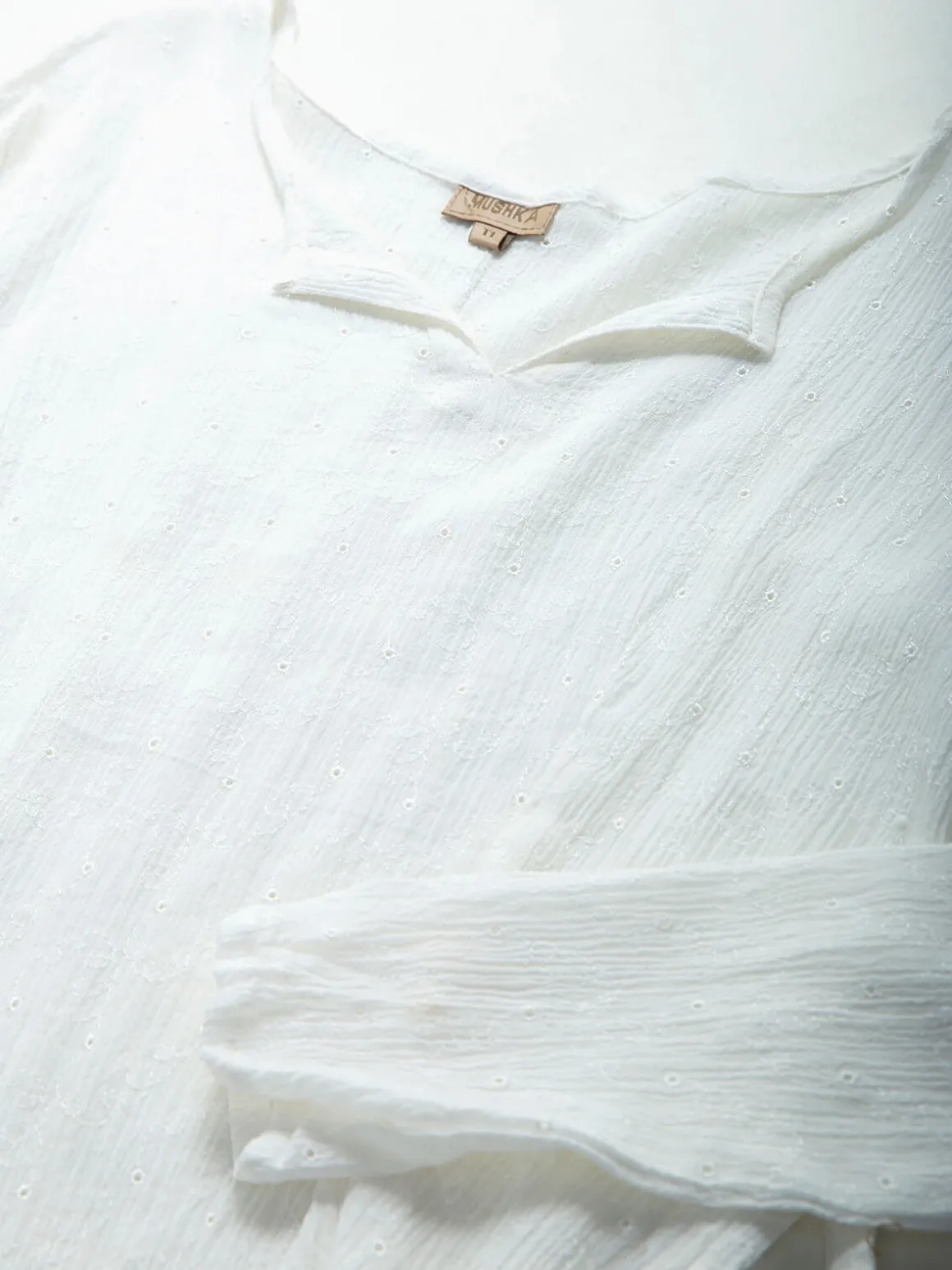 Blusa texturizada manga comprida