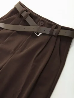 Calças de fazenda com cinto