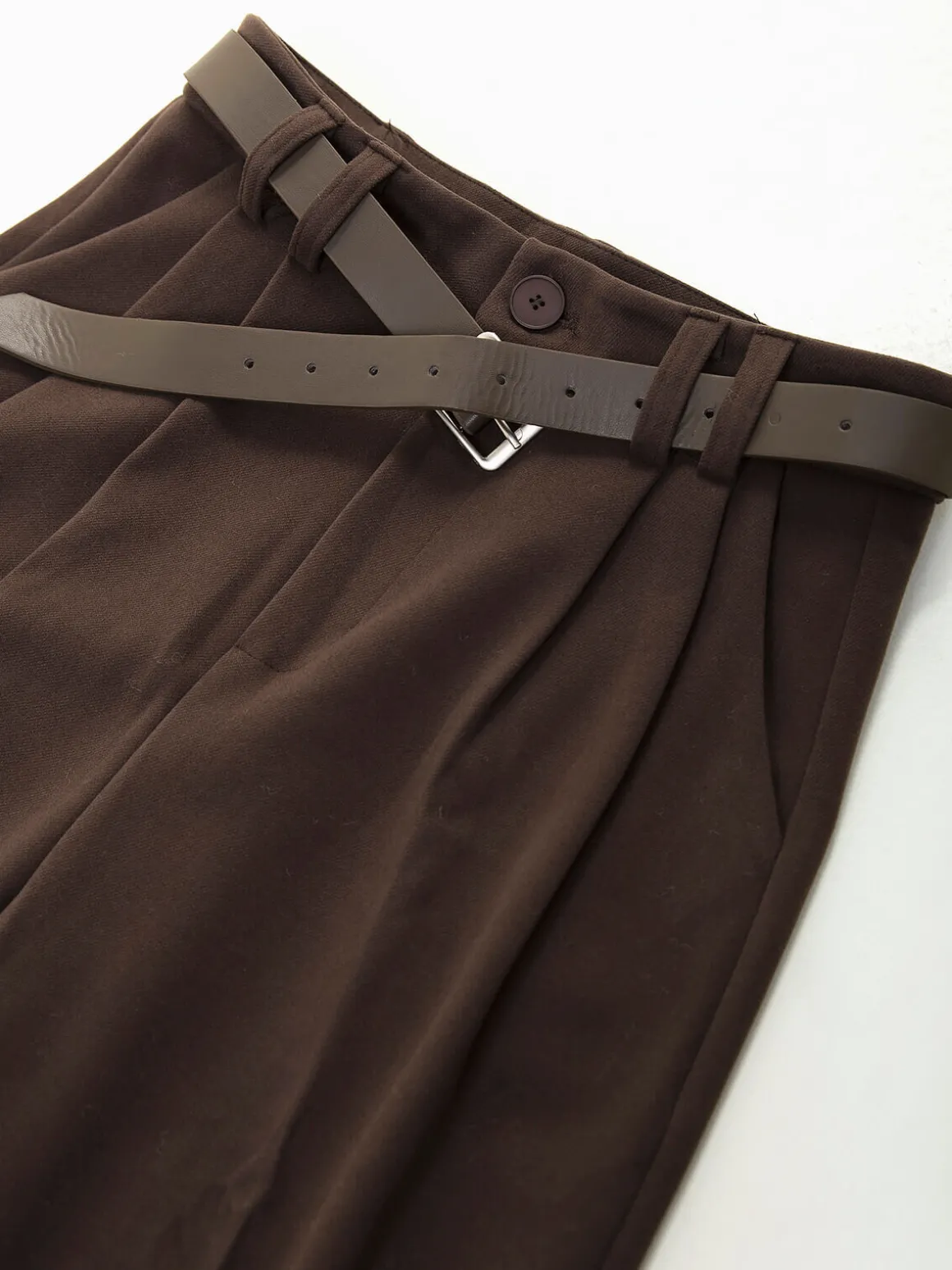 Calças de fazenda com cinto