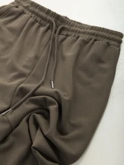 Calças desportivas com bolsos