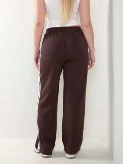 Calças desportivas com faixa lateral