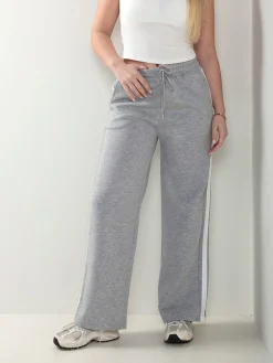 Calças desportivas com faixa lateral