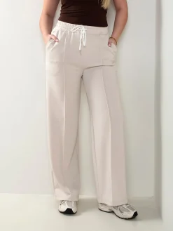 Calças fato treino com costura frontal