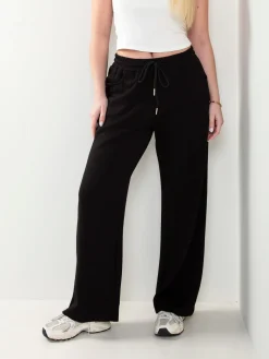 Calças fato treino largas