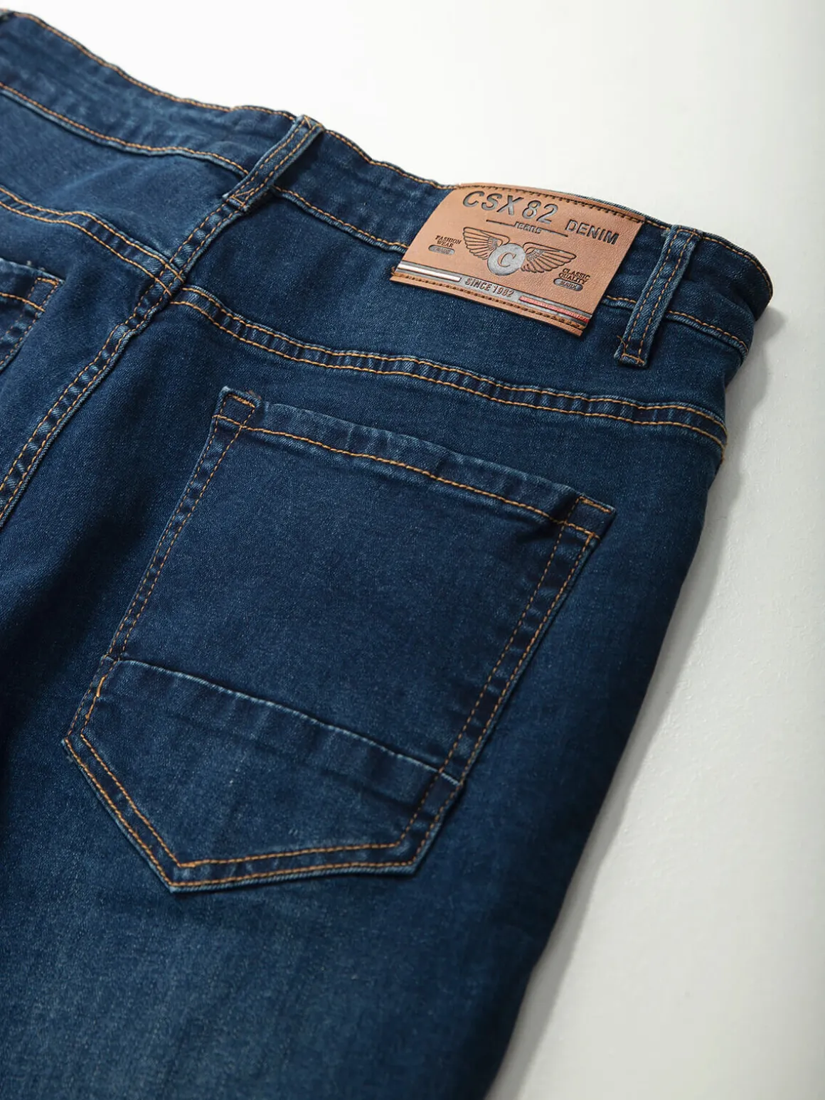 Calças ganga elásticas com botões