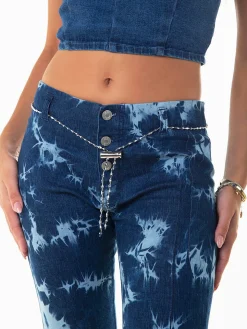 Calças ganga flare manchadas