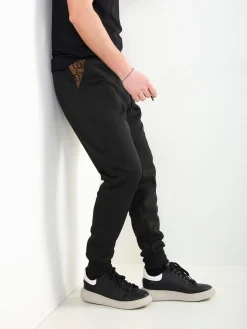 Calças jogger pretas com estampado