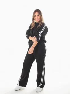 Calças largas riscas laterais