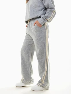 Calças largas riscas laterais