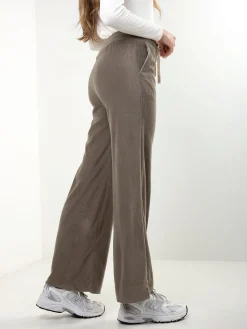 Calças malha efeito aveludado cintura alta