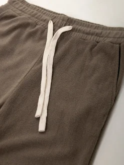 Calças malha efeito aveludado cintura alta