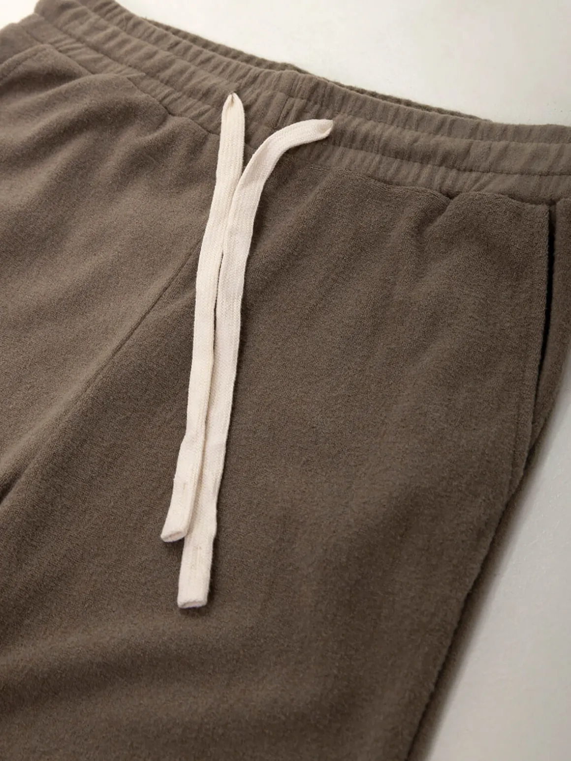 Calças malha efeito aveludado cintura alta