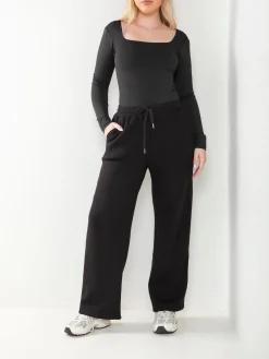 Calças malha largas interior cardado