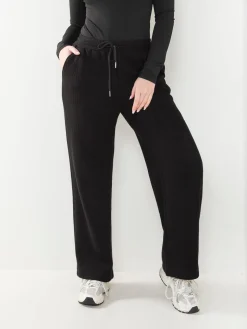 Calças malha largas interior cardado