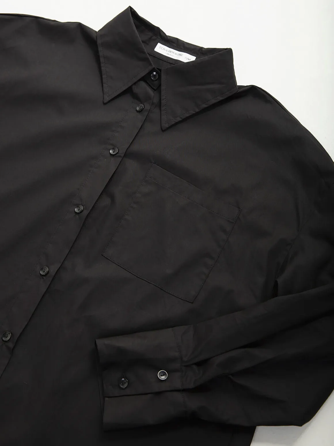 Camisa oversized com bolso no peito