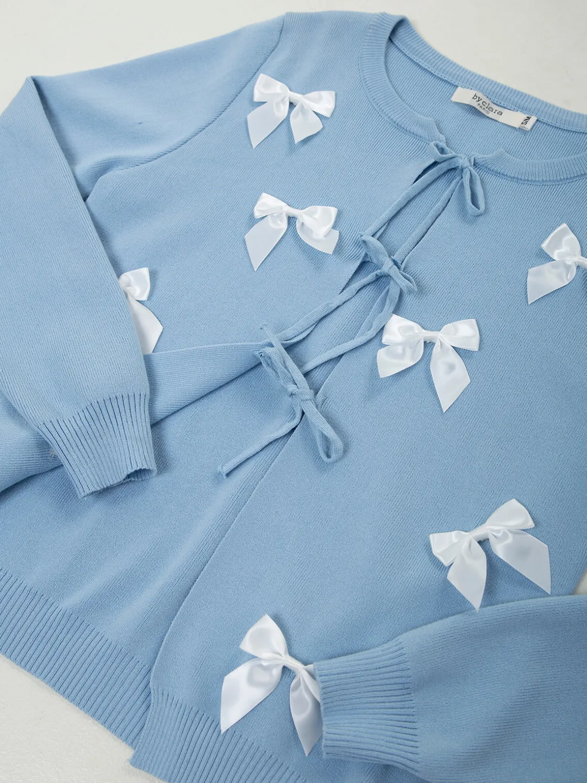 Casaco de malha com laços