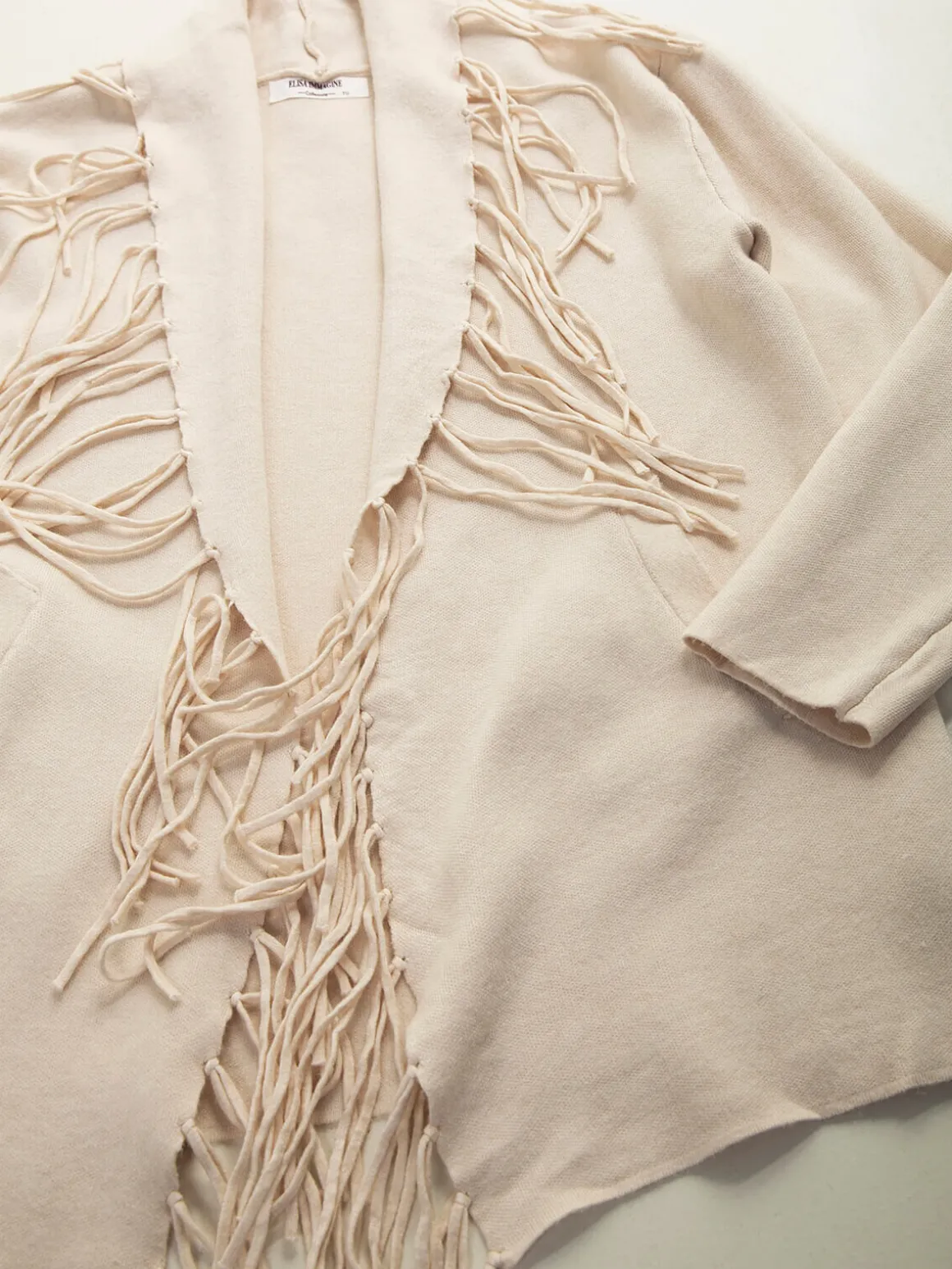 Casaco malha aberto com franjas