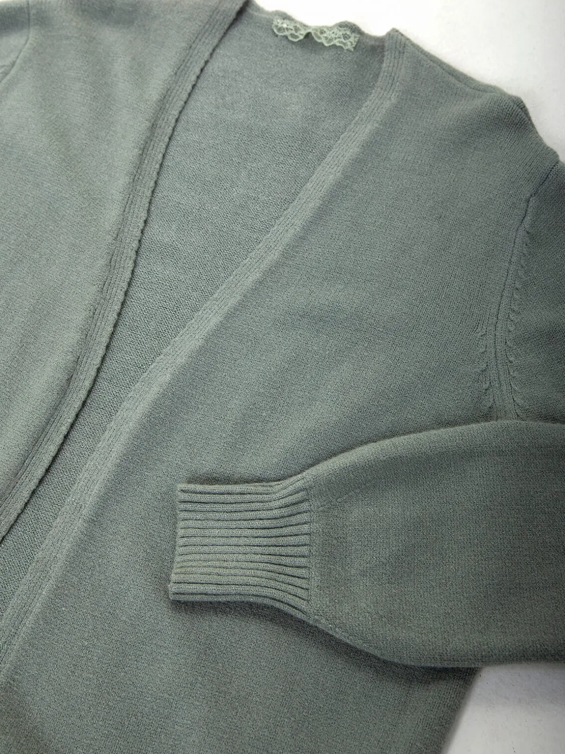 Casaco malha comprido com bolsos