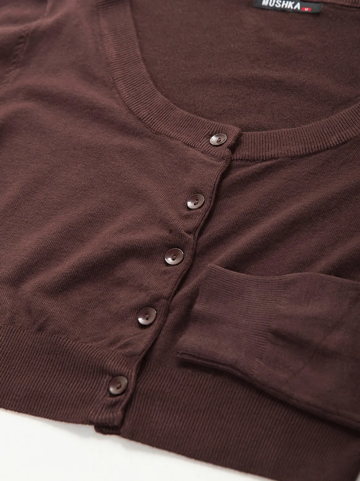 Casaco malha estilo bolero com botões