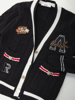 Casaco malha preto com aplicações