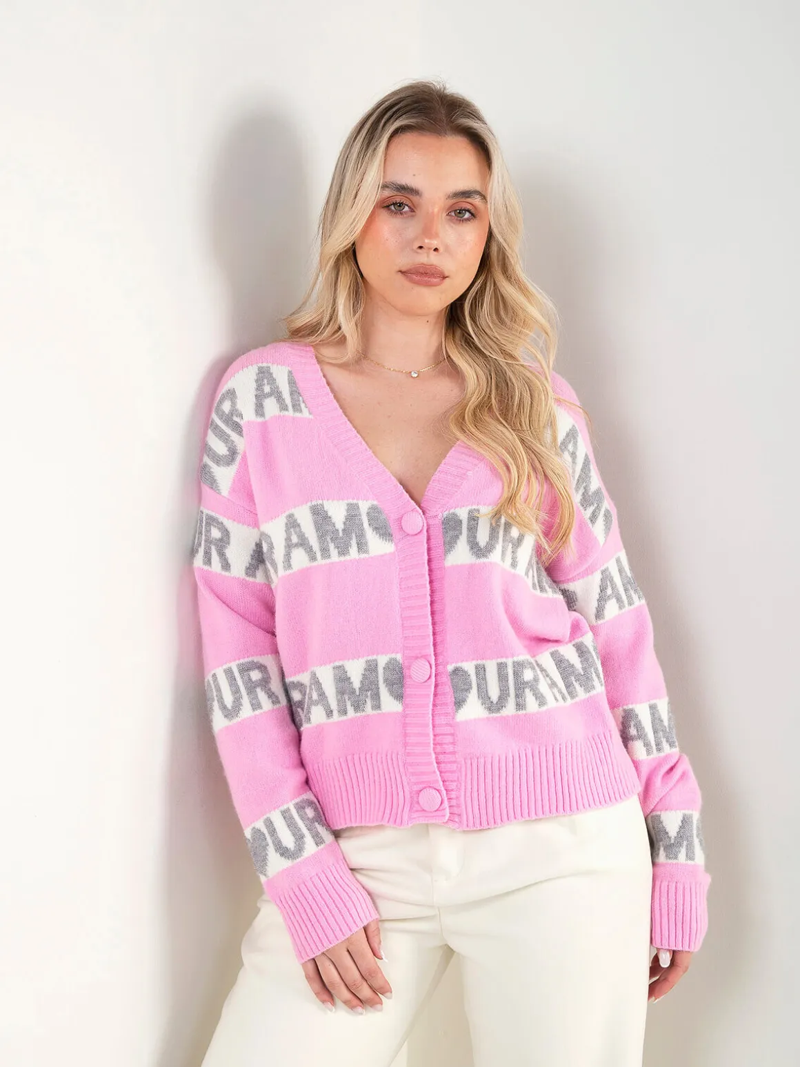 Casaco malha rosa com padrão contraste