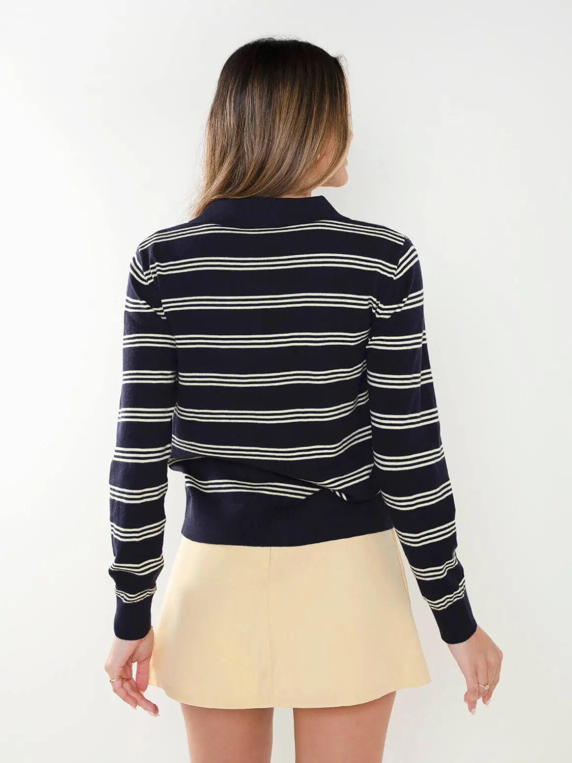 Casaco malha às riscas gola polo