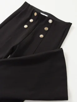 Leggings à boca de sino com botões