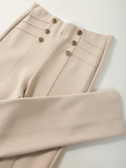 Leggings cintura alta botões dourados